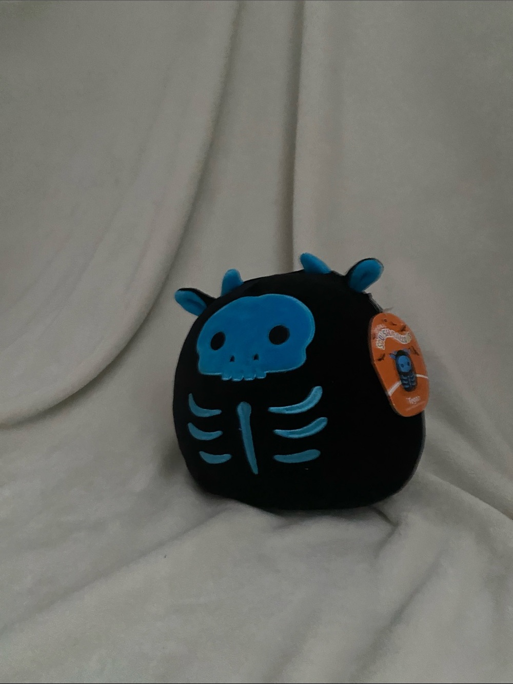 Squishmallows Black Plush with Bright Blue Skeleton Design